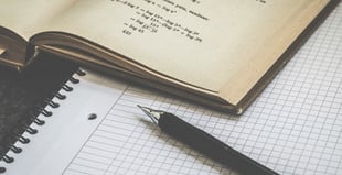 Image of a pen and paper.