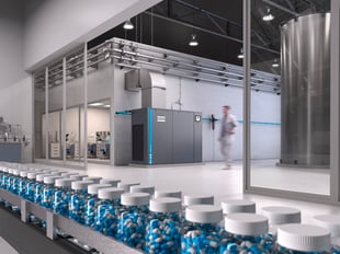 Man in pharmaceutical manufacturing plant walking past a compressor