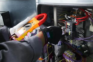 Atlas Copco Service Technician testing an Air Compressor