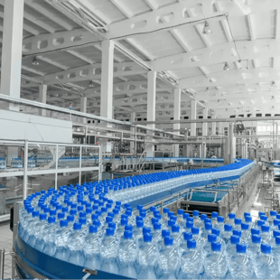 PET bottling plant with bottles on conveyor belt