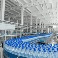 PET bottling plant with bottles on conveyor belt