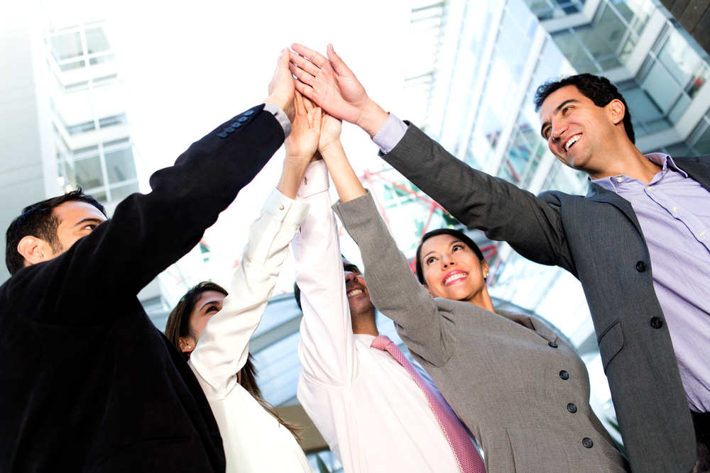 Group of employees high fiving