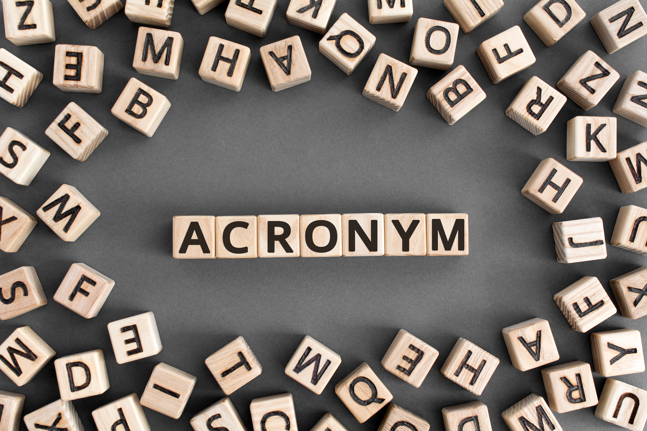 Scrabble tiles spelling out acronym