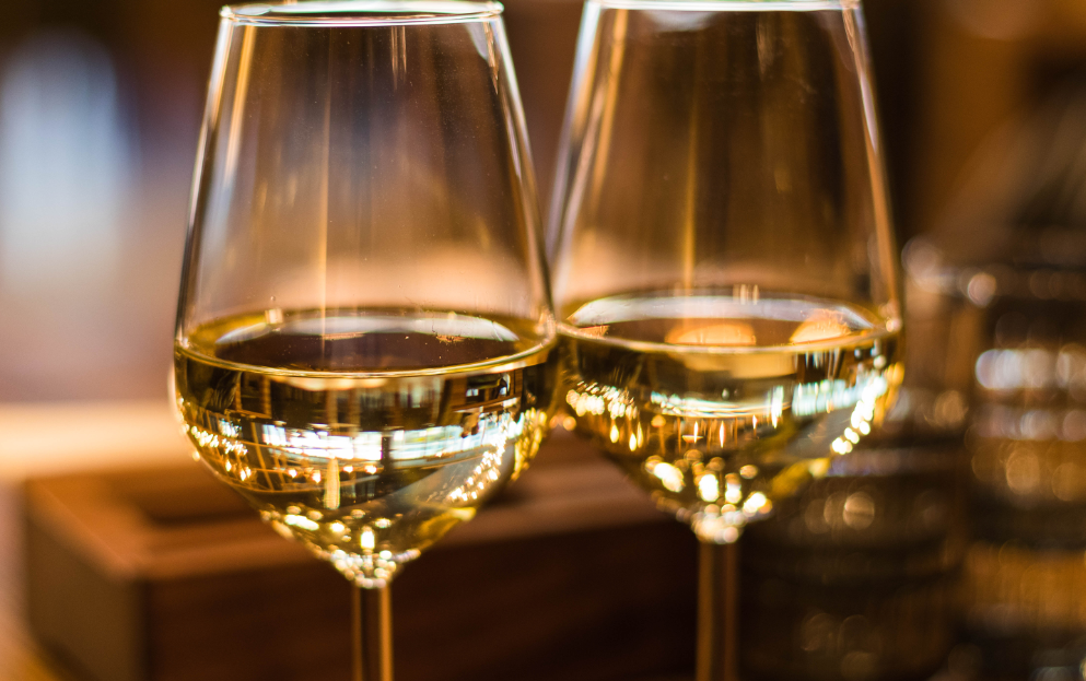 Close up image of (white) wine glasses